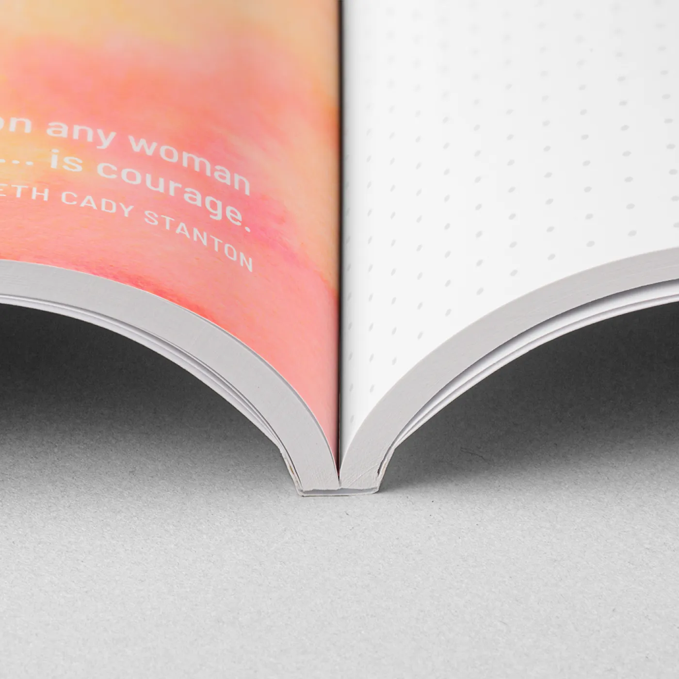 ImageWrap hardcover notebook shown open to a green page with a white contour pattern design and a white page of black text.