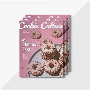 A stack of three magazines titled Cookie Culture: The Holiday Issue, with a photo of iced ting cookies on the front cover
