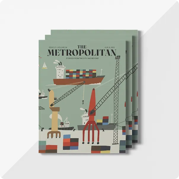 A stack of three magazines titled The Metropolitan, with an illustrated shipping port scene on the front cover