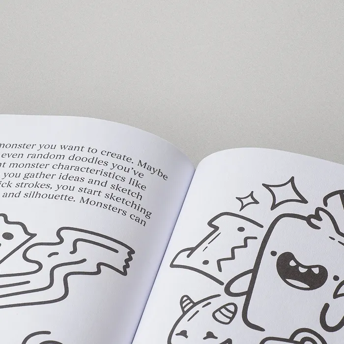 Open book with black-and-white illustrated line art on one page and text on the other.