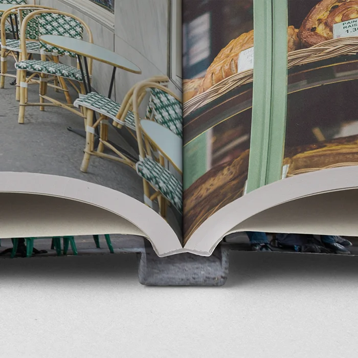 Close-up of an ImageWrap hardcover photo book showing a sturdy spine and image wrapped around the cover.
