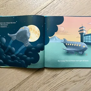 Daniel Peddle's hardcover children's book, The Little Plane That Wouldn't, open on a page of illustrations and text