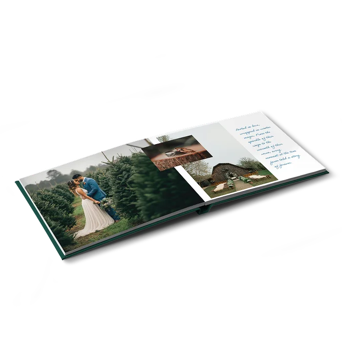A landscape hardcover photo book open on photos from a wedding paired with handwritten text