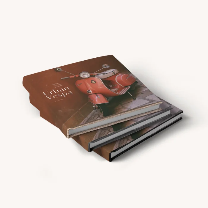 Stack of linen hardcover with dust jacket photo books with a red scooter on the cover and the title "Life in Italy."