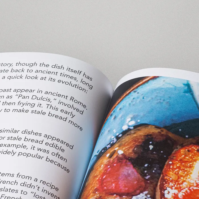 Open book showing a full-page food photograph with text on the facing page.