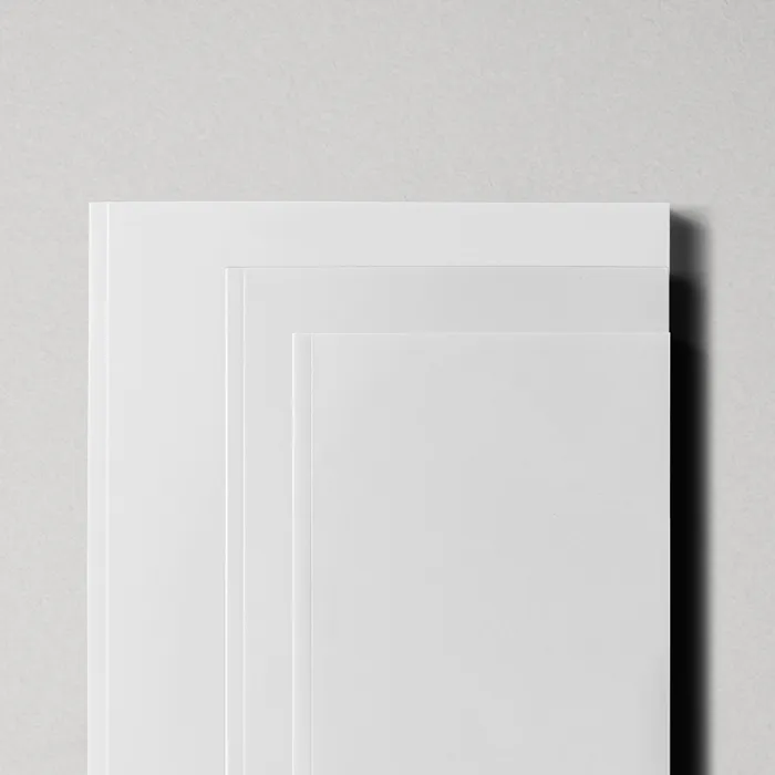 Close-up of stacked white book covers in different standard sizes.