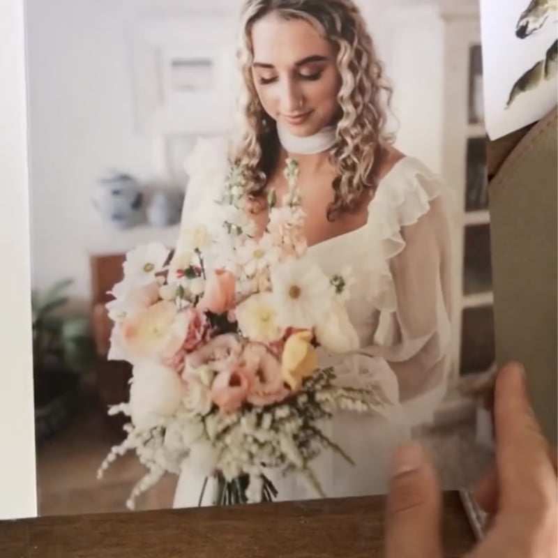 Person holding a bouquet of flowers