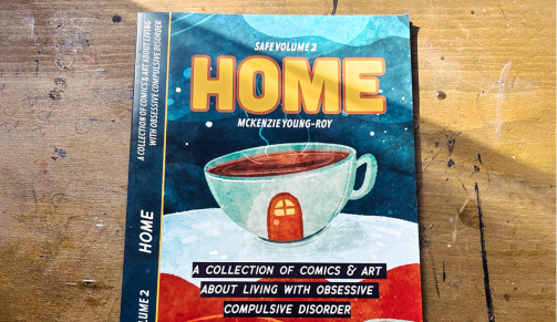 Custom designed magazine titled Safe Volume 2, Home, by McKenzie Young-Roy, A collection of comics and art about living with obsessive compulsive disorder, featuring an illustrated coffee cup with a door drawn on the side.