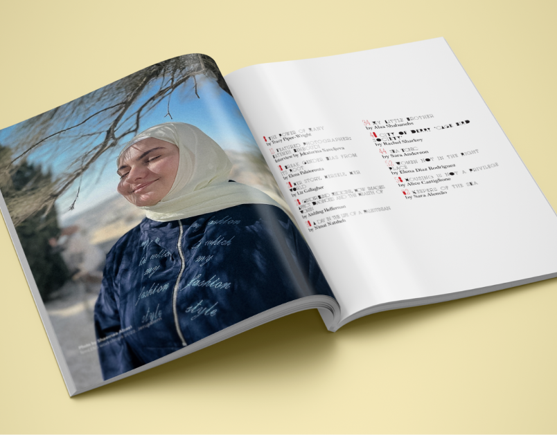 Custom magazine shown open featuring a person smiling on one page, text on the opposite page.