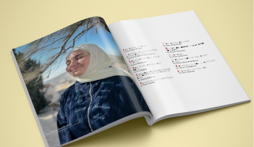 Custom magazine shown open featuring a person smiling on one page, text on the opposite page.