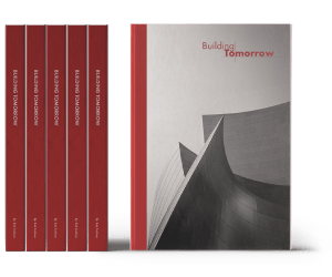 Multiple copies of the book shown titled Building Tomorrow